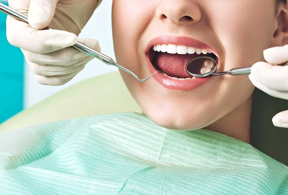 Kid at pediatric dentistry getting dental treatment