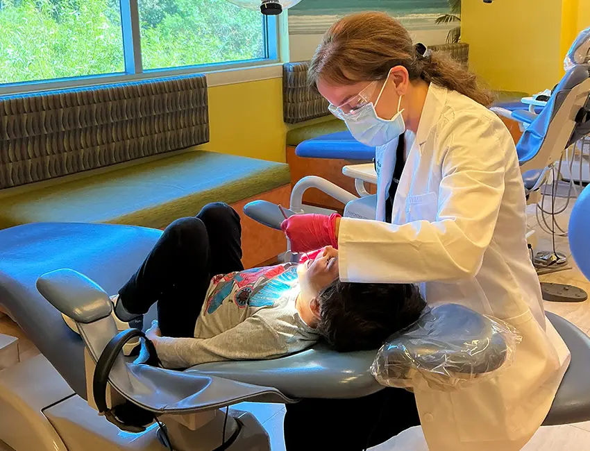 Pediatric dentist in Carlsbad treating kids smile