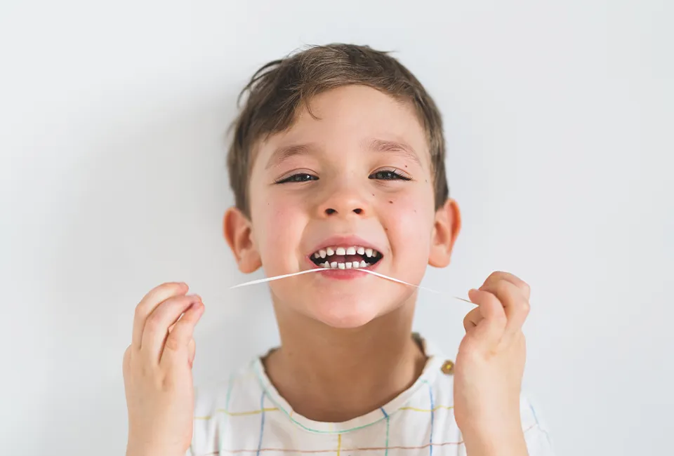 Kid flossing