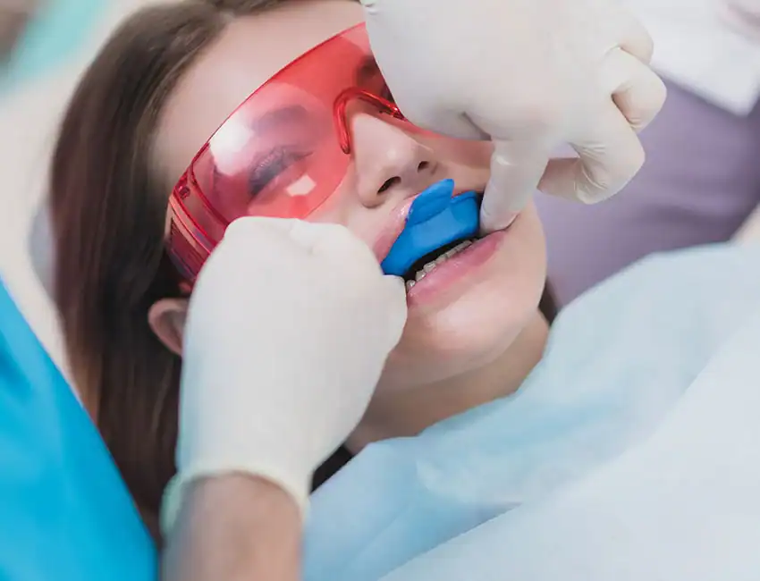 Patient getting fluoride treatment in Carlsbad, CA