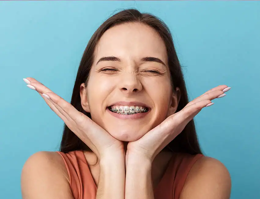 Happy smiling teen patient with braces in Carlsbad, CA